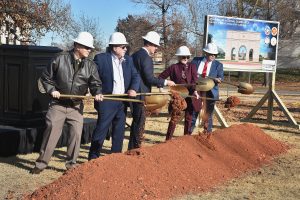 CeremonySpeakersTurnSoilAtNationalGuardArchGroundbreaking